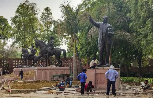 Statues of BR Ambedkar and others during relocation within the Parliament premises as part of the redevelopment project. l Photo: PTI