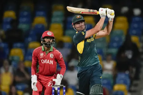 Australia's Marcus Stoinis hits a six during the men's T20 World Cup cricket match between Australia and Oman at Kensington Oval in Bridgetown, Barbados. l Photo: AP