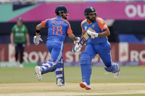 ndia's captain Rohit Sharma, right, and partner Virat Kohli run between wickets to score against Ireland during an ICC Men's T20 World Cup cricket match at the Nassau County International Cricket Stadium in Westbury, New York. l Photo: AP/PTI