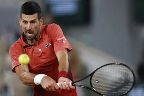 Serbia's Novak Djokovic plays a shot against Italy's Lorenzo Musetti during their third round match of the French Open tennis tournament at the Roland Garros stadium in Paris. Photo: AP/PTI