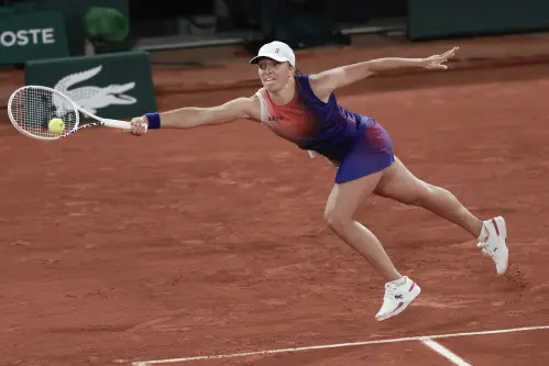 Iga Swiatek saves a match point and comes back to beat Naomi Osaka at the French Open