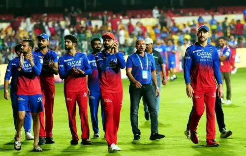 Royal Challengers Bengaluru players acknowledge fans as they celebrate after winning their Indian Premier League (IPL) 2024 cricket match against Chennai Super Kings, at M Chinnaswamy Stadium in Bengaluru. l Photo: PTI