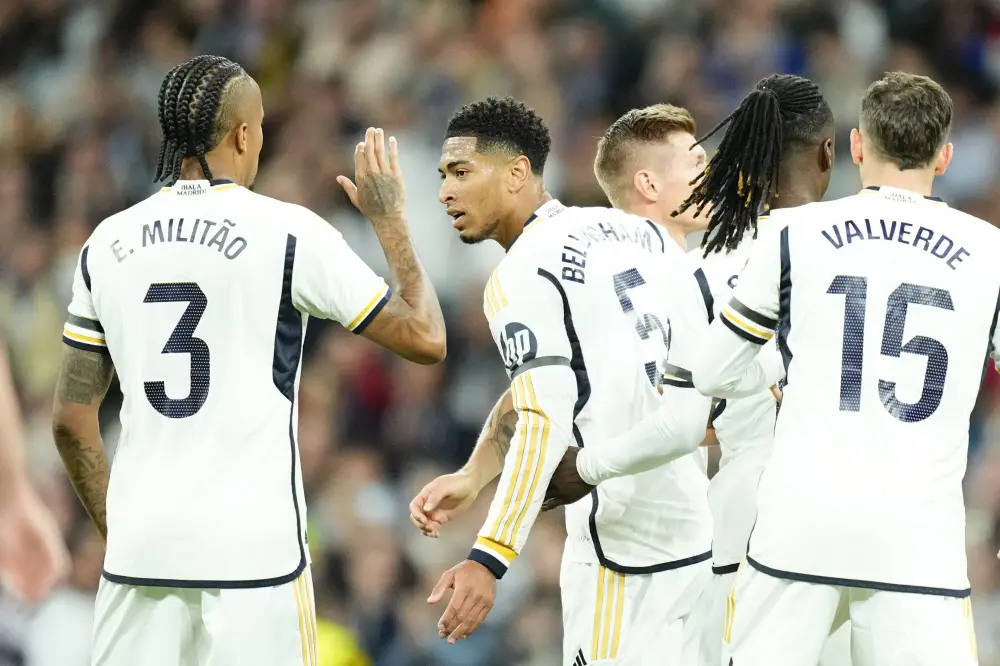 Jude Bellingham, centre, with Real Madrid's Eder Militao during the Spanish La Liga soccer match | AP