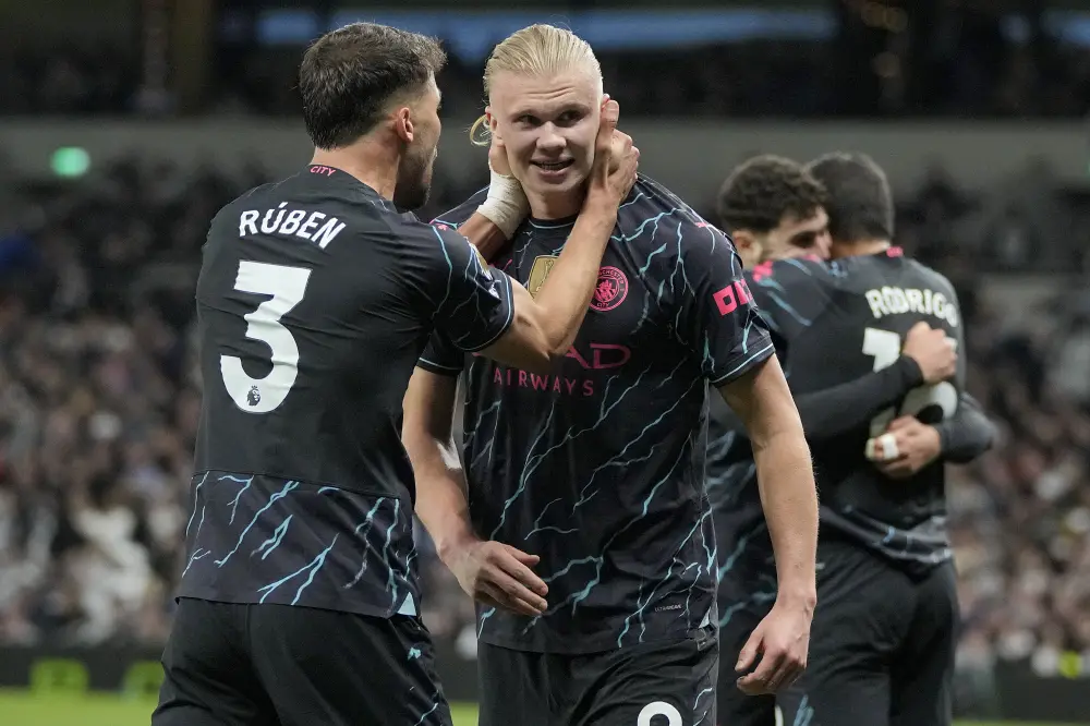 Erling Haaland, centre, and Manchester City's Ruben Dias celebrate scoring their side's second goal | AP