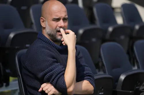 Coach Guardiola urges Man City to seize chance to make Premier League history