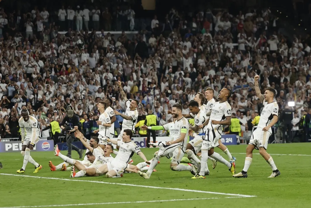 Real Madrid's players celebrate victory at the end of the UEFA Champions League semifinal match between Real Madrid CF and FC Bayern Munich | Photo: AFP
