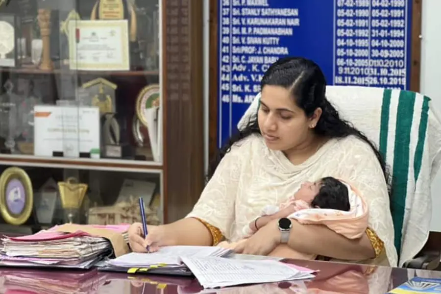 Arya Rajendran works in office holding her newborn baby close; pic goes viral