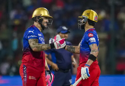 Royal Challengers Bengaluru batter Faf du Plessis being gretted by Virat Kohli on his fifty during the Indian Premier League (IPL) 2024 T20 cricket match between Royal Challengers Bengaluru and Gujrat Titans, at M Chinnaswamy Stadium in Bengaluru. l Photo: PTI