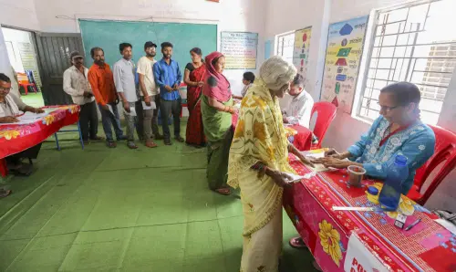 Voters going through the election procedure | Photo- PTI