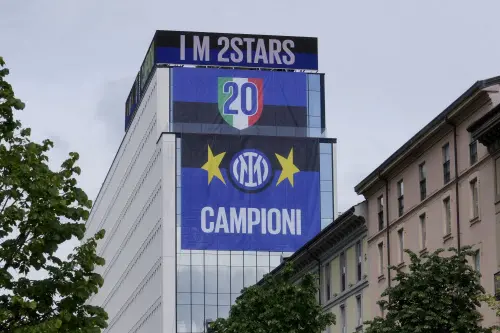 Banners reading 20 and Champions hang on the Inter Milan headquarter in Milan, Italy. l Photo: AP
