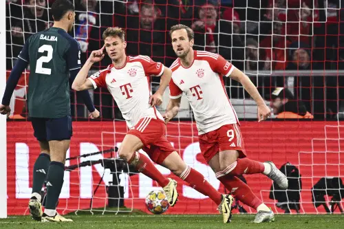 Bayern's Joshua Kimmich, center, and Harry Kane (9) celebrate after Kimmich scored during the Champions League quarter final second leg soccer match between Bayern Munich and Arsenal at the Allianz Arena in Munich, Germany. l Photo: AP