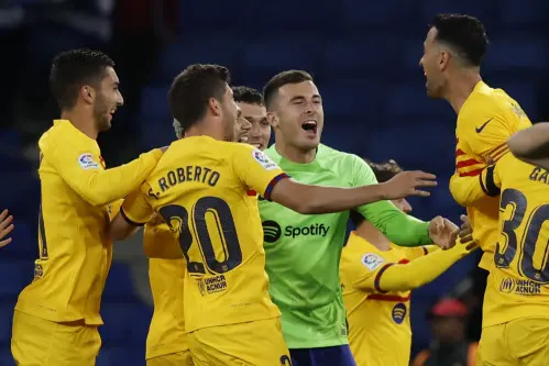 Barcelona earn La Liga title with Espanyol rout