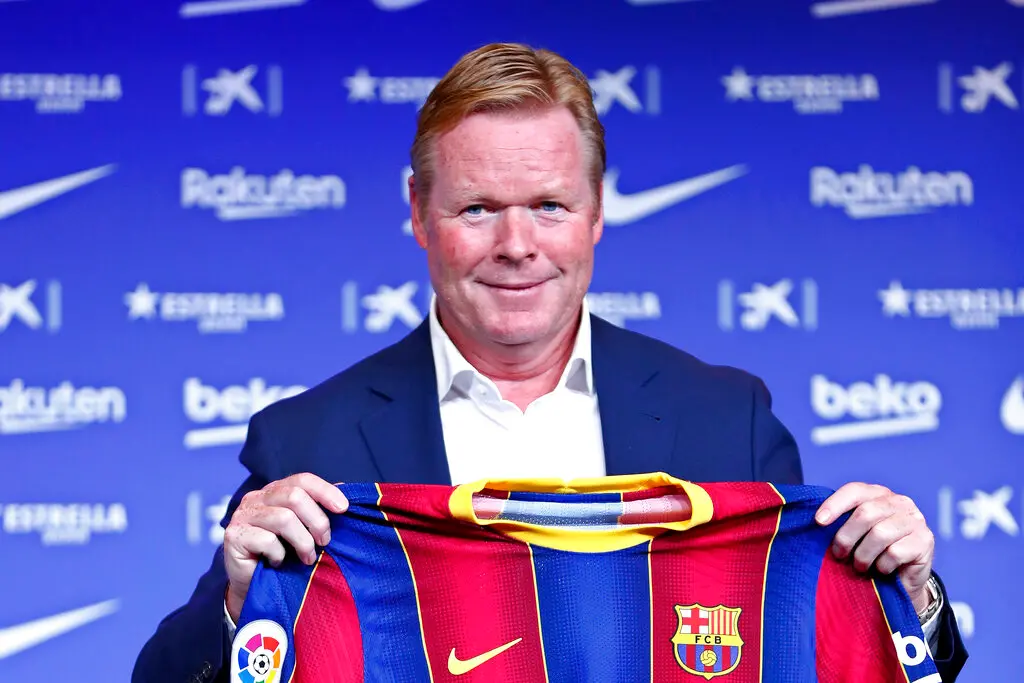 Ronald Koeman holds up a Barcelona shirt during his official presentation as FC Barcelona coach (AP photo)