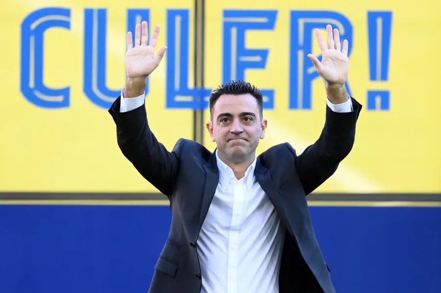 Barcelona fans welcome new coach Xavi at the Camp Nou