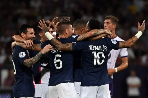 Neymar (R) is congratulated by teammates after scoring a goal | AFP