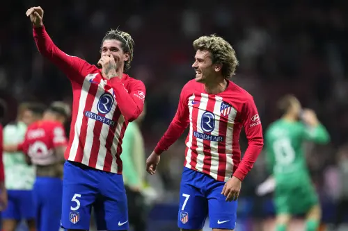 Atletico Madrid's Antoine Griezmann and Atletico Madrid's Rodrigo De Paul celebrate their victory at the Champions League quarterfinal soccer match between Atletico Madrid and Borussia Dortmund at the Metropolitano stadium in Madrid. l Photo: AFP