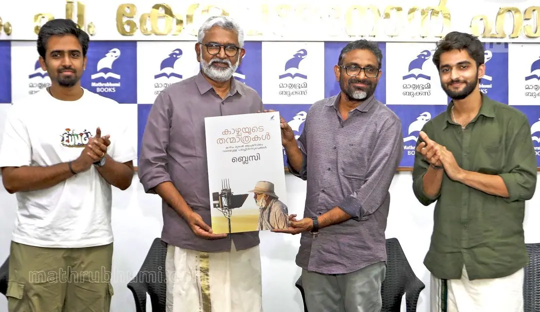 Cover release of Blessy's upcoming book, 'Kaazhchayude Thanmaathrakal', by Benyamin at K P Kesava Menon Hall. Singer Jithin Raj and actor K R Gokul, nearby | Photo K K Santhosh\Mathrubhumi