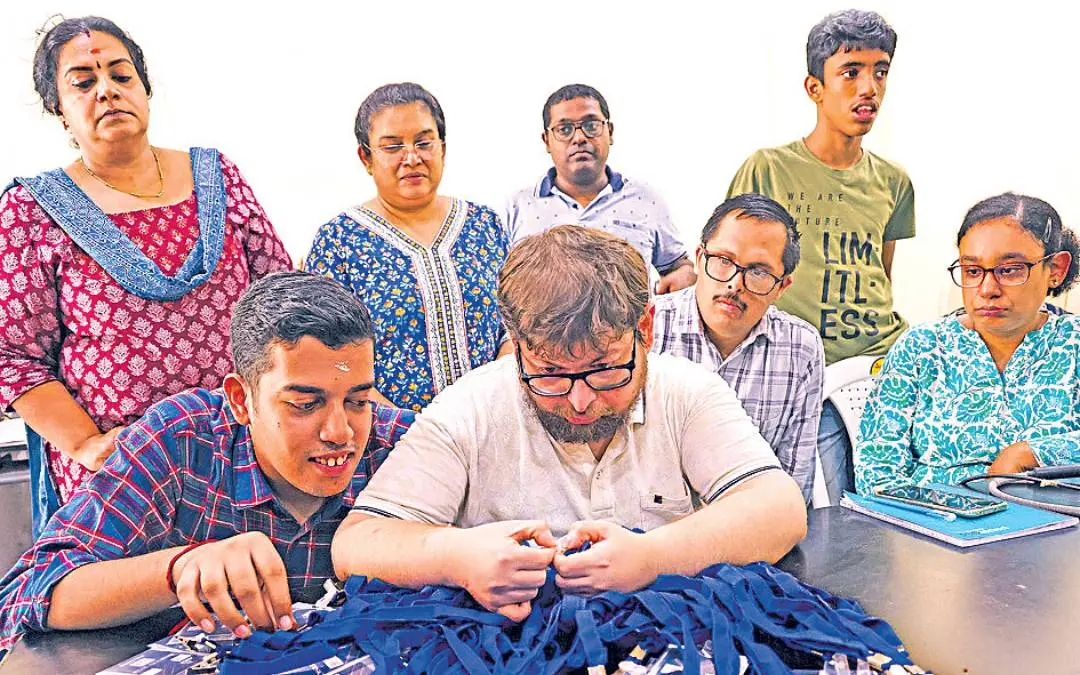 The differently-abled organisers preparing the registration cards | Photo: Mathrubhumi