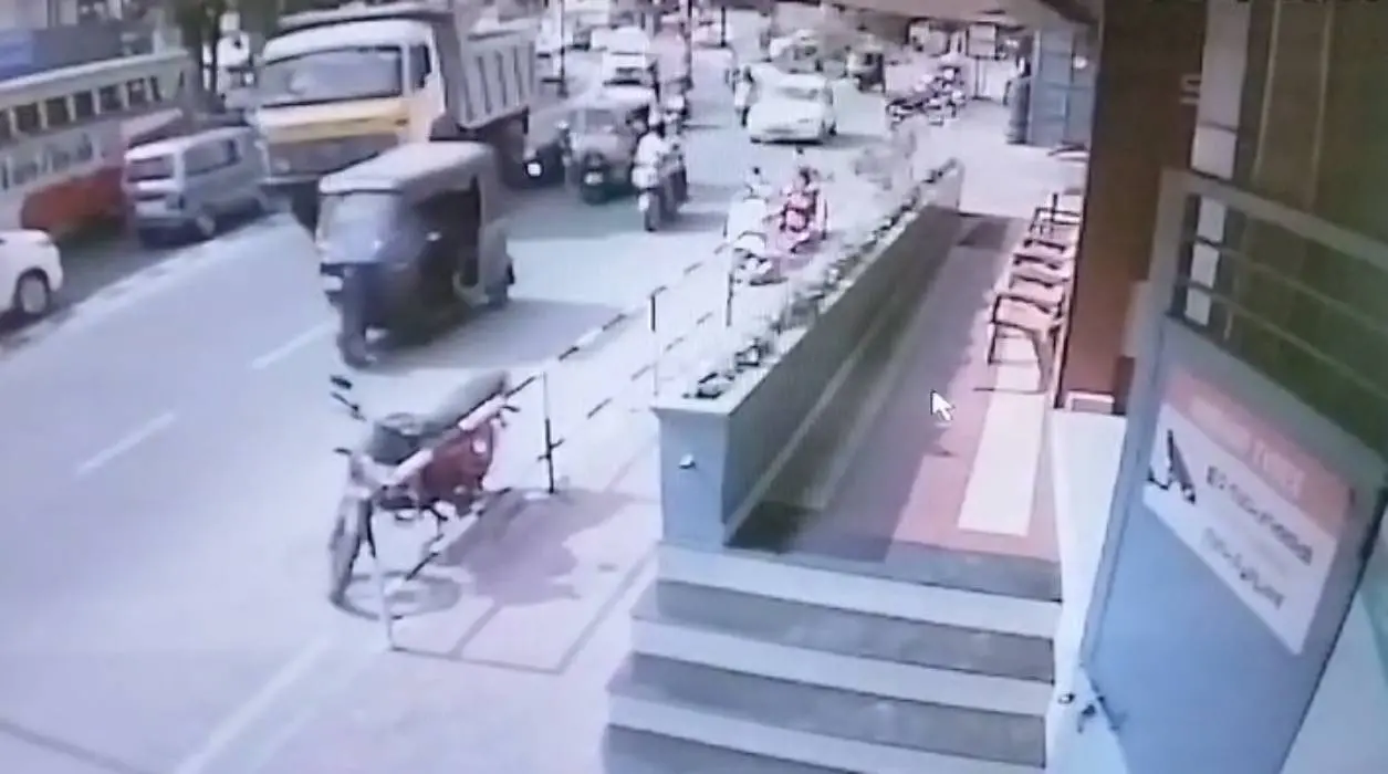 Truck collides with scooter | Screengrab : CCTV footage