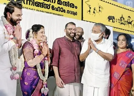 CM Pinarayi Vijayan greeting the couple during the wedding function