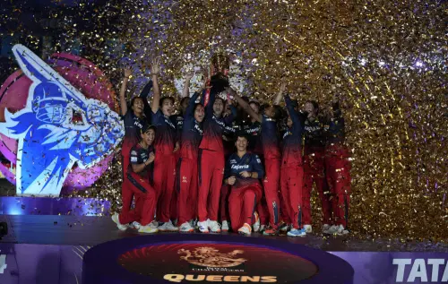 Royal Challengers Bangalore players celebrate with the trophy after winning the WPL-T20 final cricket match against Delhi Captals at the Arun Jaitley Stadium, in New Delhi, on Sunday. (Photo: PTI)