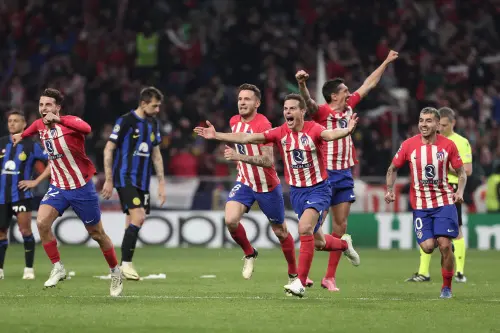 Atletico Madrid's players celebrate victory at the end of the UEFA Champions League last 16 second leg football match between Club Atletico de Madrid and Inter Milan at the Metropolitano stadium in Madrid. (Photo: AFP)
