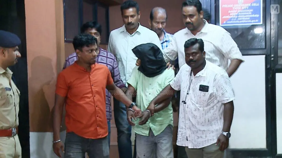 Accused Hassan Kuttty being nabbed | Photo: Mathrubhumi