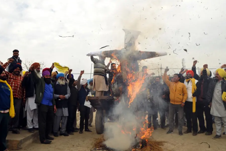 Farmers camping at Punjab-Haryana border burn effigies to protest against WTO