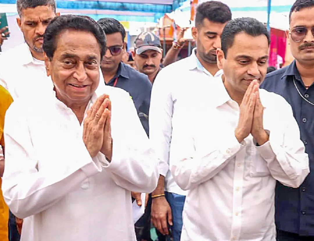 Kamal Nath with his son and party MP Nakul Nath | File photo: ANI