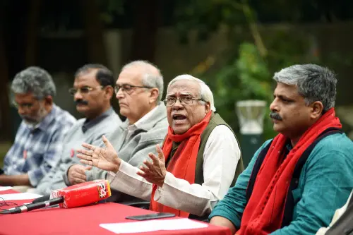 All India Kisan Sabha leader Hannan Mollah (2R) addresses media after Prime Minister Narendra Modi's announcement to repeal the three farm laws, in New Delhi on Friday. (ANI Photo)