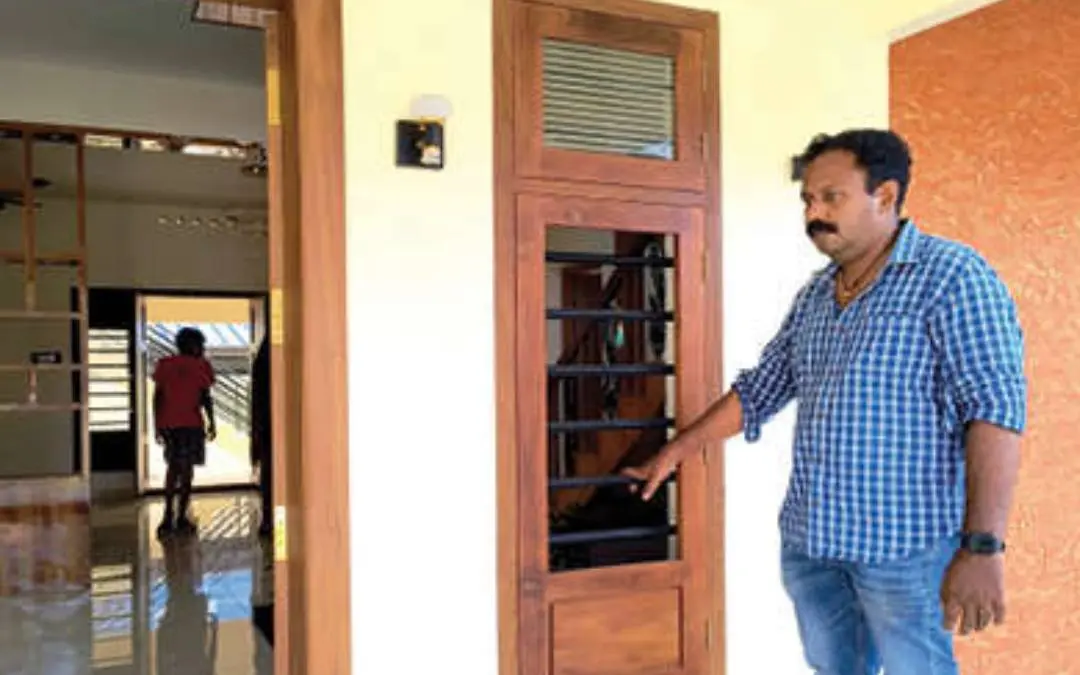 Sreenath in front of his newly-built house