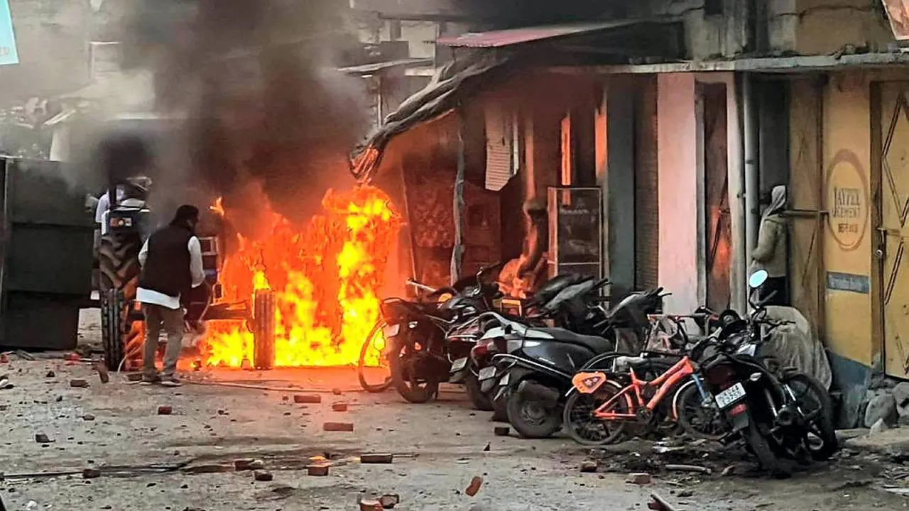 Vehicles set on fire in Haldwani. | Photo - PTI