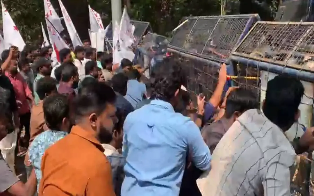 DYFI workers in front of the police barricades,. (Screengrab)