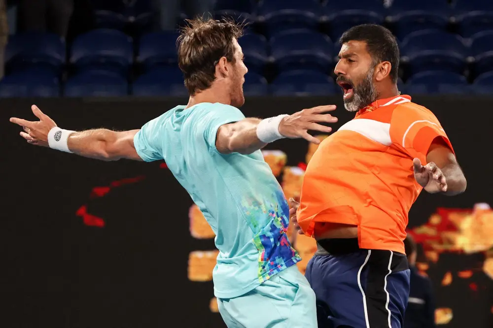 Rohan Bopanna (R) and Australia's Matthew Ebden celebrate after victory against Italy's Simone Bolelli and Andrea Vavassori | AFP
