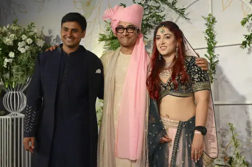 Bollywood actor Aamir Khan pose for photographers with his son-in-law and Indian fitness coach, consultant, and athlete Nupur Shikhare (L) and his daughter Ira Khan (L) as they arrive at their wedding ceremony in Mumbai on January 3, 2024. Photo: AFP