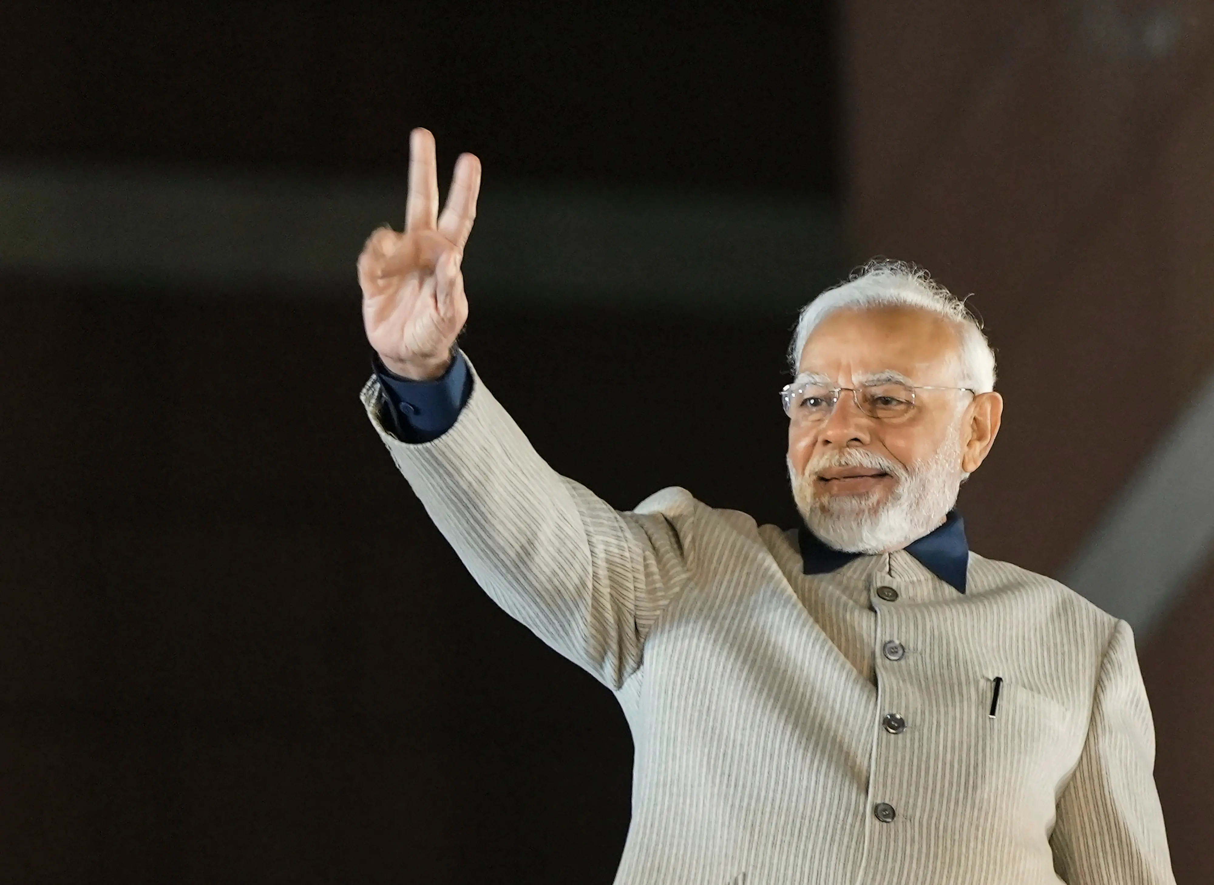 Prime Minister Narendra Modi flashes victory sign during the celebrations of BJP's victory in the Gujarat Assembly elections, at BJP headquarters in New Delhi. Photo: PTI