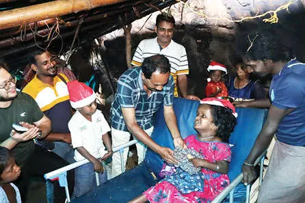 Meeenakshi receiving her new year/christmas gift.