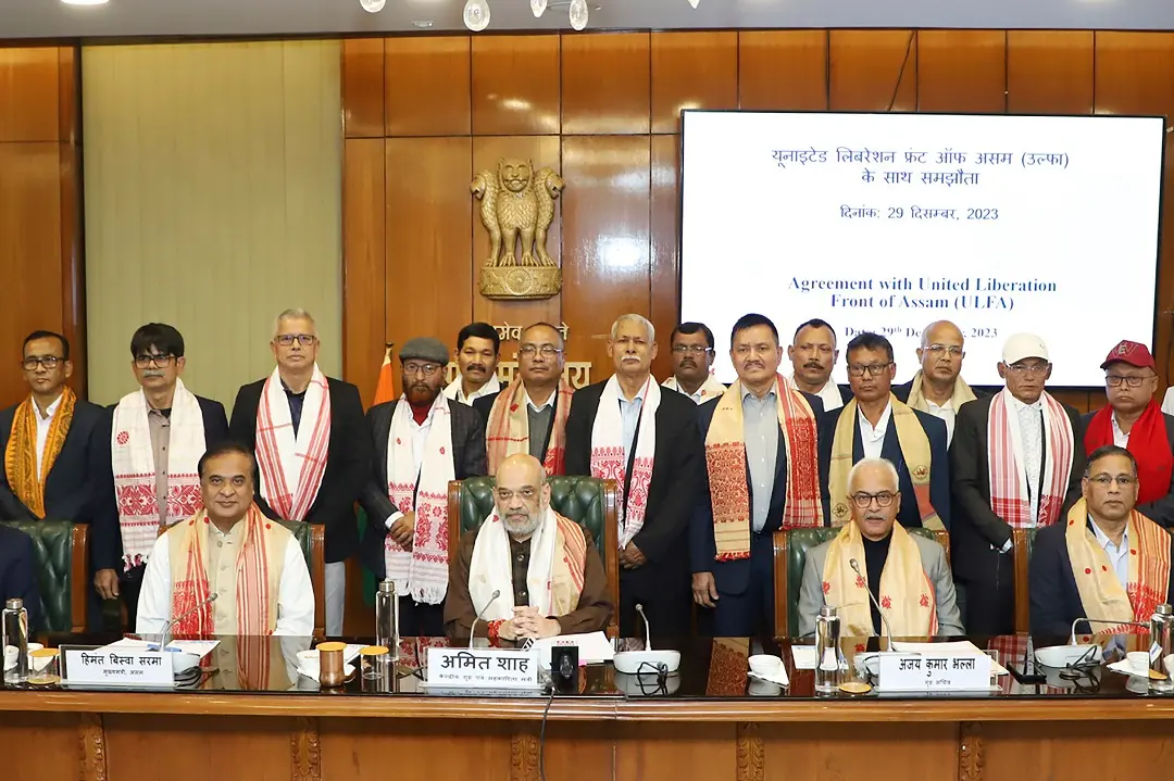 Indian Home Minister, Amit Shah, center, poses for a photograph with the leaders of the United Liberation Front of Assam (ULFA) after signing a memorandum of settlement with them in New Delhi | Photo: Press Information Bureau via AP