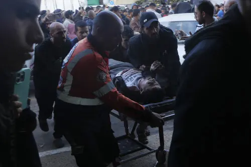 Palestinians wounded in the Israeli bombardment of the Gaza Strip are brought to the hospital in Deir al Balah, Gaza Strip, on Sunday, Dec. 24, 2023. AP/PTI(