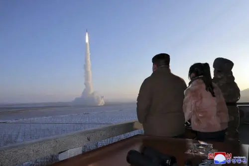 FILE - In this undated photo provided Monday, Dec. 18, 2023, by the North Korean government, North Korean leader Kim Jong Un, his daughter and an official watch what it says is an intercontinental ballistic missile launching from an undisclosed location in North Korea. Photo: AP