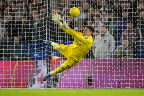 Chelsea's goalkeeper Djordje Petrovic saves a shot from Newcastle's Matt Ritchie during a penalty shoot out during the English League Cup quarterfinal soccer match between Chelsea and Newcastle United at Stamford Bridge in London, Tuesday, Dec. 19, 2023. Chelsea won the match 4-2 on a penalty shoot out after the match ended 1-1. (AP Photo)