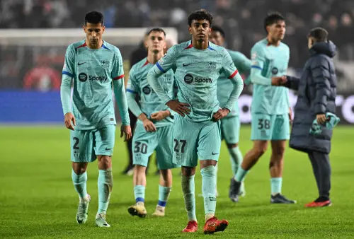 Barcelona's players react after losing at the end of the UEFA Champions League Group H football match between Royal Antwerp FC and FC Barcelona at the Bosuilstadion in Antwerp, on December 13, 2023. (Photo: AFP)