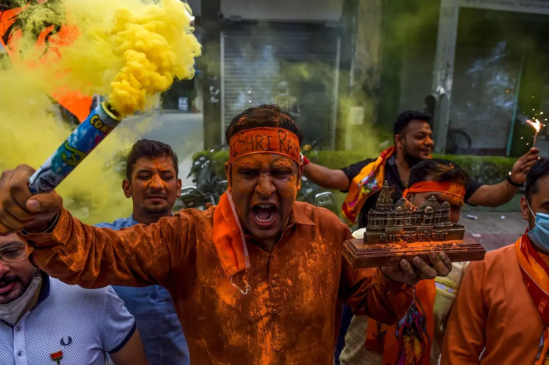 Bharatiya Janata Party (BJP) activists and supporters shout slogans as they celebrate before the groundbreaking ceremony of the Ram Temple in Ayodhaya, in New Delhi on August 5, 2020. | File photo: AFP