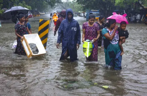 Chennai: People wade through a waterlogged road during heavy rain owing to Cyclone Michaung, in Chennai, Monday, Dec. 4, 2023. (PTI Photo)