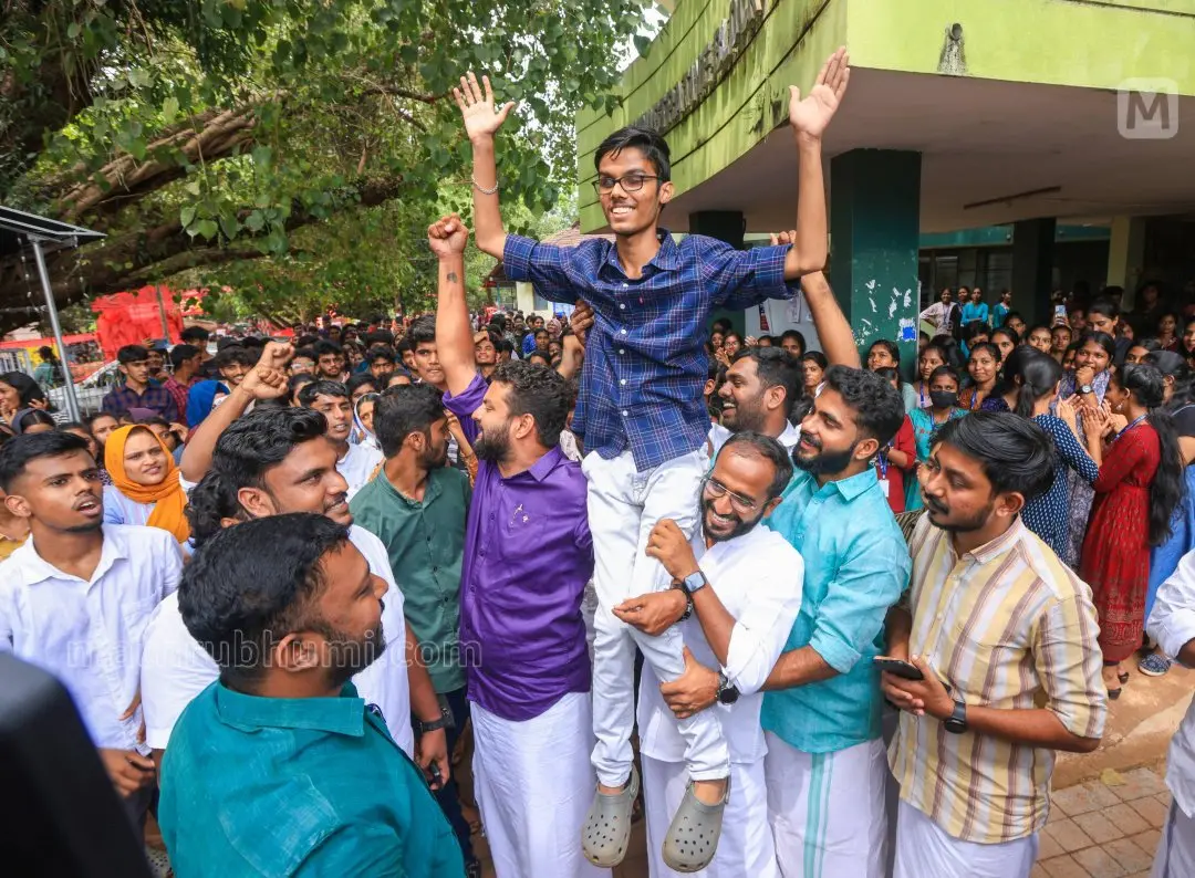 KSU candidate S Sreekuttan being lifted by the KSU supporters after initial counting. | Photo: Mathrubhumi