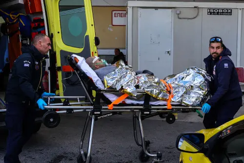 Medical staffs carry on a stretcher a survivor from the Comoros-flagged cargo ship that has sunk off the island of Lesbos, at a hospital on Lesbos Island on November 26, 2023. A Comoros-flagged cargo ship with 14 people on board has sunk off the island of Lesbos in gale-force winds, the Greek coastguard said on November 26, 2023, prompting a major rescue operation. A navy helicopter picked up one crew member of the RAPTOR cargo ship, according to the coastguard, who has been taken to Lesbos General Hospital. Photo: AFP