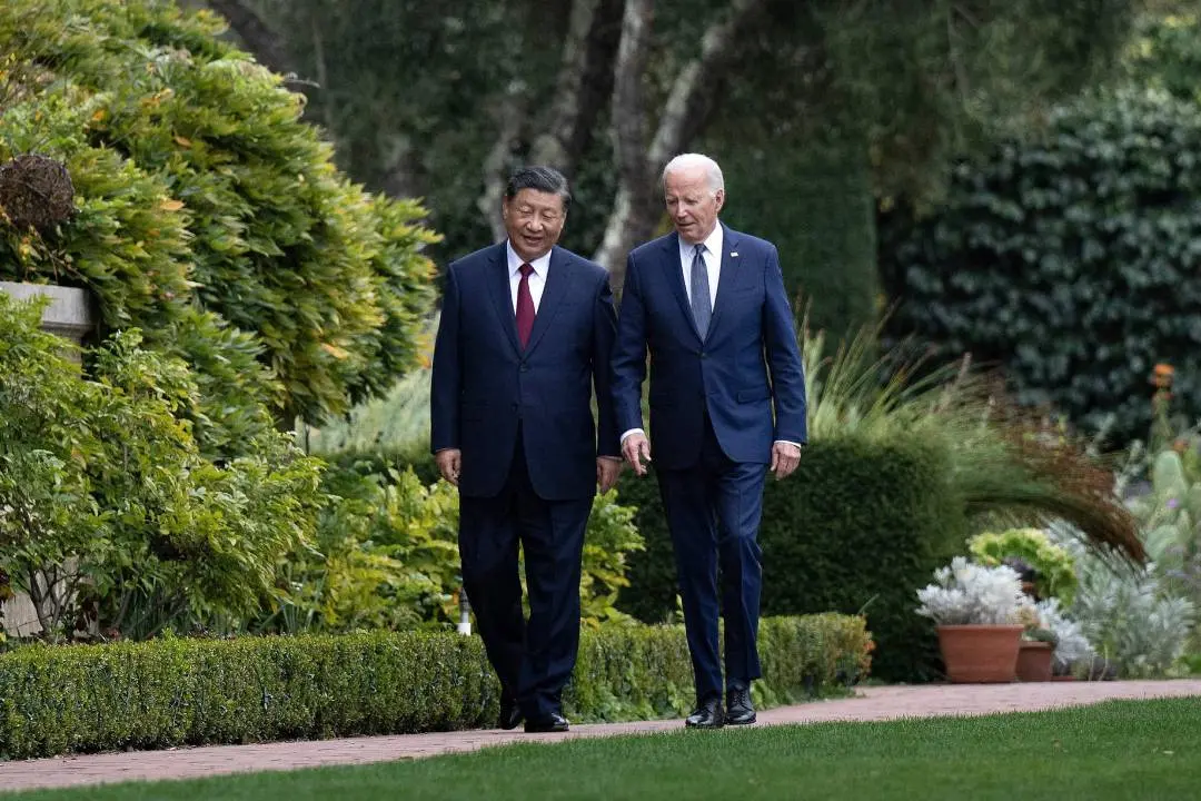 US President Joe Biden (R) and Chinese President Xi Jinping walk together after a meeting during the Asia-Pacific Economic Cooperation (APEC) Leaders' week in Woodside, California on November 15