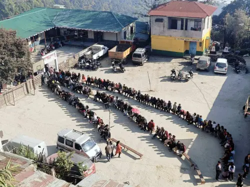 Mizoram, Nov 7 (ANI): Voters wait in queues to cast their votes for the Mizoram Assembly elections, on Tuesday. (ANI Photo)