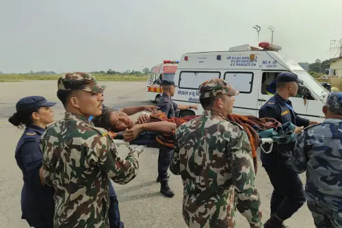 A woman airlifted from an earthquake-affected area is carried on a stretcher in Nepalgunj, Nepal, Saturday, Nov. 4, 2023. A strong earthquake has shaken northwestern Nepal, and officials say more than 100 people are dead and dozens more injured as rescuers search mountain villages. AP/PTI