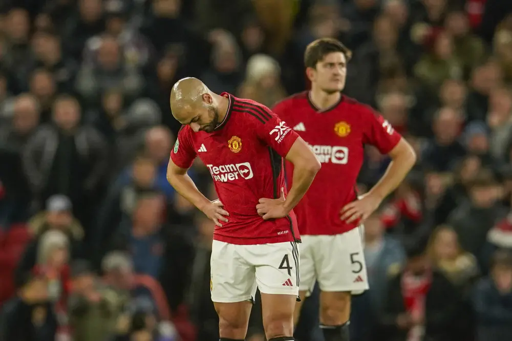 Sofyan Amrabat, front and Manchester United's Harry Maguire react during the match | AP